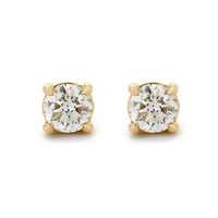 Round brilliant diamond stud earrings in yellow gold