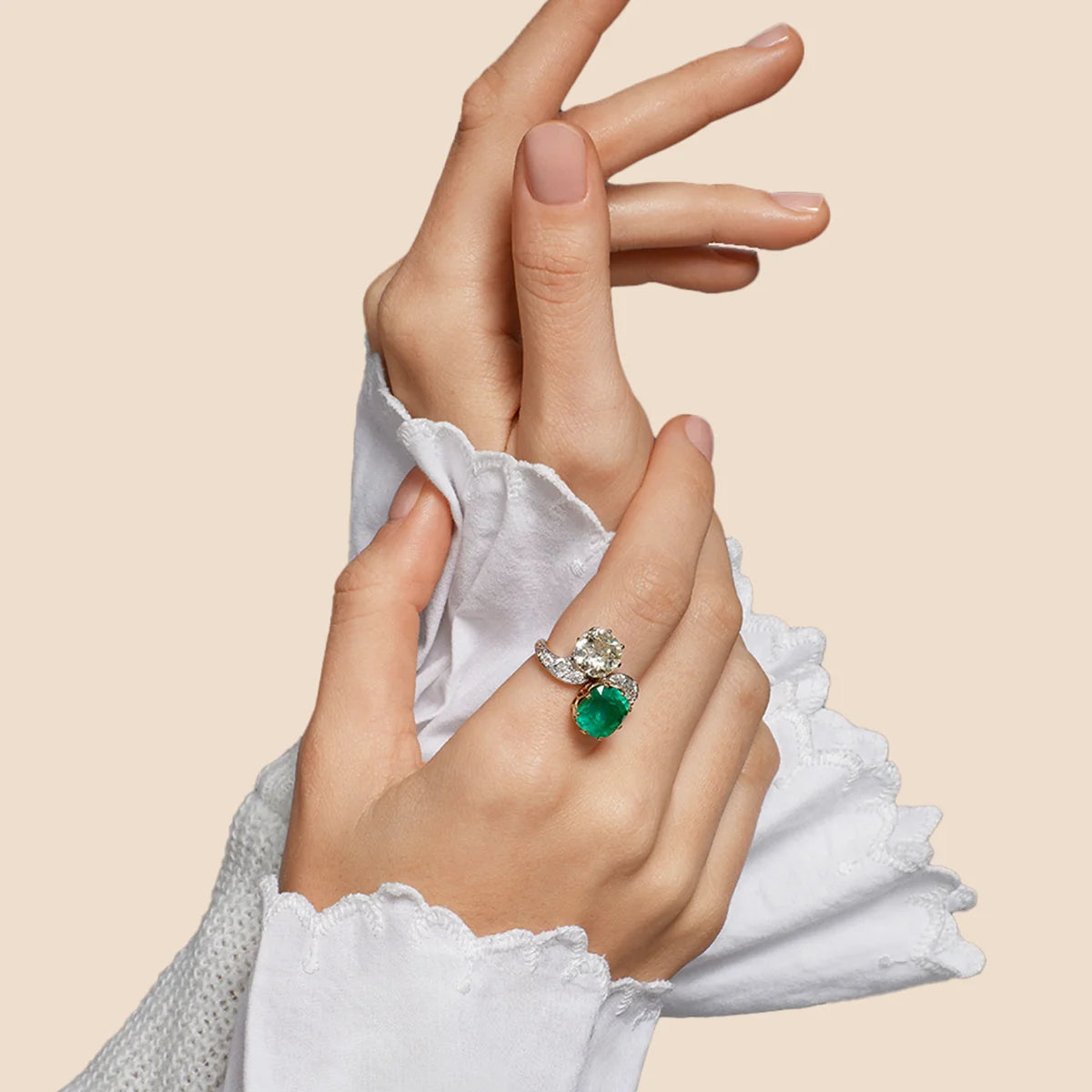 Model wearing Edwardian 3.95ct Colombian Emerald & 3.17ct Diamond Toi et Moi Ring