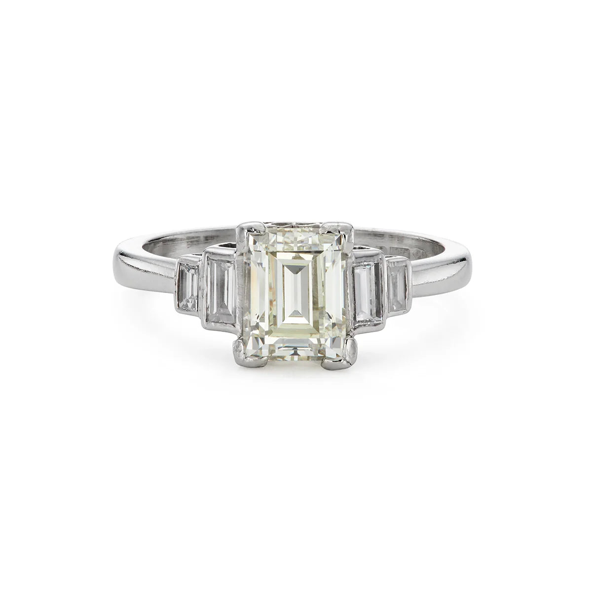 Modern emerald cut 1.40ct five stone diamond engagement ring in platinum