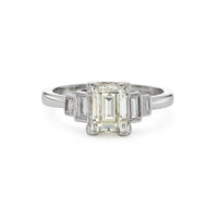Modern emerald cut 1.40ct five stone diamond engagement ring in platinum