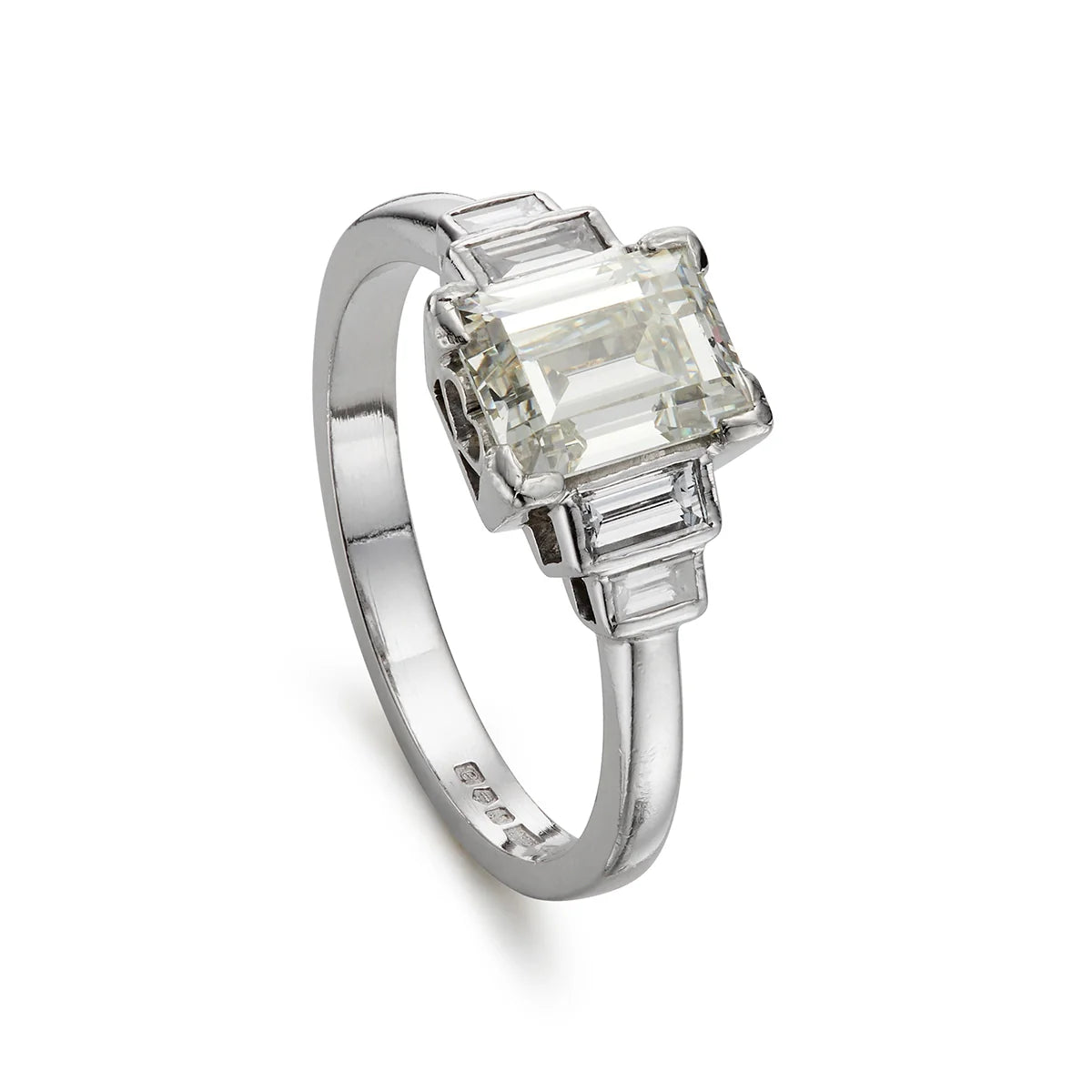 Modern emerald cut 1.40ct five stone diamond engagement ring in platinum