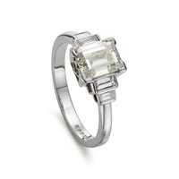 Modern emerald cut 1.40ct five stone diamond engagement ring in platinum