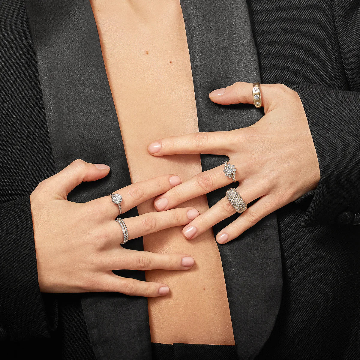 Model wearing a selection of diamond rings