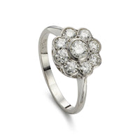 Modern 1.00ct diamond cluster engagement ring in platinum