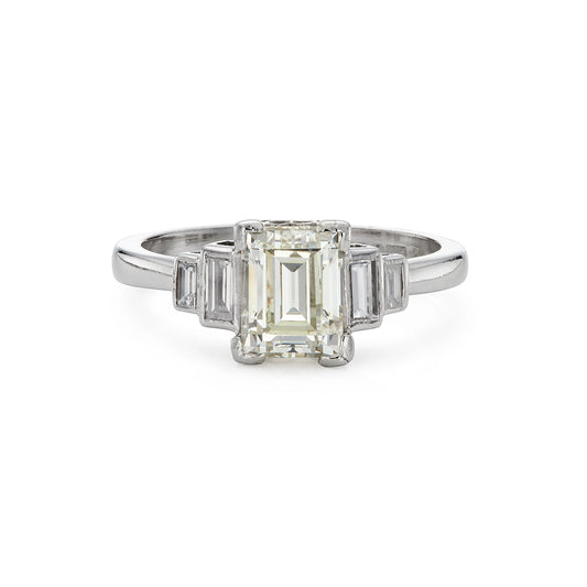 Modern emerald cut 1.40ct five stone diamond engagement ring in platinum